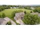 Beautiful aerial view of a brick home surrounded by lush greenery and a large, well-maintained lawn at 5698 Kenderly Ct, Carmel, IN 46033