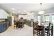 Eat-in kitchen featuring granite counters, stainless appliances, and a center island at 5698 Kenderly Ct, Carmel, IN 46033