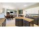 Bright kitchen open to the living space, featuring granite counters, stainless appliances, and a center island at 5698 Kenderly Ct, Carmel, IN 46033