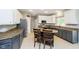 Spacious kitchen featuring granite countertops, stainless steel appliances, and a center island with seating at 5698 Kenderly Ct, Carmel, IN 46033