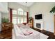 Spacious living room with high ceilings, fireplace, and large windows at 5698 Kenderly Ct, Carmel, IN 46033