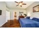 Serene main bedroom featuring hardwood floors, a vaulted ceiling, large dresser and plenty of natural light at 5698 Kenderly Ct, Carmel, IN 46033