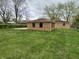 Expansive backyard with well-maintained lawn and brick exterior at 5774 N Ewing St, Indianapolis, IN 46220
