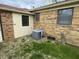 A/C unit in the backyard of a brick home at 5774 N Ewing St, Indianapolis, IN 46220