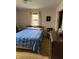 Bedroom with patterned bedspread and tan carpet at 5774 N Ewing St, Indianapolis, IN 46220