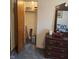 Bedroom with dark wooden dresser and closet at 5774 N Ewing St, Indianapolis, IN 46220