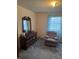 Cozy bedroom features a blue patterned curtain and comfortable chair at 5774 N Ewing St, Indianapolis, IN 46220