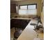 Kitchen counter workspace with desk area and natural light from the window at 5774 N Ewing St, Indianapolis, IN 46220
