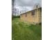 Brick house exterior with green lawn, offering plenty of backyard space at 5774 N Ewing St, Indianapolis, IN 46220