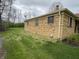 An exterior shot of a brick home with a well maintained lawn and a chimney at 5774 N Ewing St, Indianapolis, IN 46220