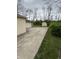 The house features a detached garage and shed with a concrete driveway for easy access and extra storage at 5774 N Ewing St, Indianapolis, IN 46220