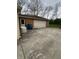 This property features a detached garage with an adjacent generator and exterior access door, offering convenience and functionality at 5774 N Ewing St, Indianapolis, IN 46220
