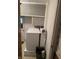 Laundry room includes washer and dryer and upper storage at 5774 N Ewing St, Indianapolis, IN 46220