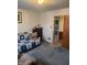 Inviting living room featuring blue carpet and a comfortable sofa at 5774 N Ewing St, Indianapolis, IN 46220
