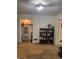 Living room featuring shelves, and a closet with items and clothes in it at 5774 N Ewing St, Indianapolis, IN 46220