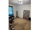 A living room featuring a media cabinet and bookcase full of DVDs at 5774 N Ewing St, Indianapolis, IN 46220
