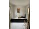 Mud room provides two doors leading to the exterior with an interior door and black mat at 5774 N Ewing St, Indianapolis, IN 46220