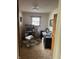 A home office featuring a computer, desk, rolling chair, and window at 5774 N Ewing St, Indianapolis, IN 46220