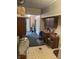 Utility area with storage cabinets, bins, and access to the backyard, providing ample space and convenience at 5774 N Ewing St, Indianapolis, IN 46220