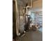 Basement utility room housing the furnace, water heater, and other mechanicals, ensuring functionality at 5774 N Ewing St, Indianapolis, IN 46220