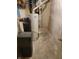 Basement featuring a water softener, hot water heater, carrier furnace, and painted walls at 5912 Accent Dr, Indianapolis, IN 46221