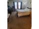 Bedroom featuring carpet flooring, light colored walls, large window, and standard bedroom furniture at 5912 Accent Dr, Indianapolis, IN 46221