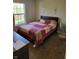 Bedroom featuring a window, carpet flooring, standard size bed and standard bedroom furniture at 5912 Accent Dr, Indianapolis, IN 46221