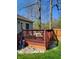 Outdoor deck features wood railing, seating, and provides a comfortable space to relax and enjoy the backyard at 5912 Accent Dr, Indianapolis, IN 46221