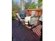 Outdoor deck features wood boards and metal furniture, ideal for outdoor dining and entertaining at 5912 Accent Dr, Indianapolis, IN 46221