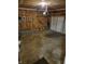 Spacious unfinished garage with concrete floor and a garage door, ample space for parking and storage at 5912 Accent Dr, Indianapolis, IN 46221