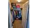 Walk-in closet with hanging clothes, carpet, shelves for ample storage, and easy access to belongings at 5912 Accent Dr, Indianapolis, IN 46221