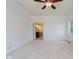Bright bedroom with neutral carpet and adjacent bathroom visible at 6345 Canak Dr, Avon, IN 46123