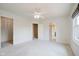 Bright and airy bedroom with neutral carpet, ceiling fan, and multiple doorways for flexible access at 6345 Canak Dr, Avon, IN 46123