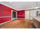 Dining area featuring wood floors, neutral wall colors, and view into the kitchen at 6345 Canak Dr, Avon, IN 46123