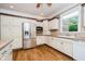 Spacious kitchen features stainless steel appliances, wood flooring, and ample countertop space at 6345 Canak Dr, Avon, IN 46123