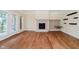 Open living room with tall ceilings, a fireplace, bright light, and light-colored walls at 6345 Canak Dr, Avon, IN 46123
