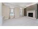 Spacious living room featuring a fireplace, plush carpeting, and ample natural light at 6345 Canak Dr, Avon, IN 46123