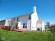 Back exterior with a wooden deck, a large yard, and a fence, providing a private outdoor retreat at 7150 Pheasant Ridge Dr, Indianapolis, IN 46237