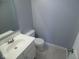 Powder room featuring a white vanity, silver faucet and toilet at 7150 Pheasant Ridge Dr, Indianapolis, IN 46237