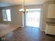 Dining area with hardwood flooring, a chandelier and a sliding glass door to outdoor space at 7150 Pheasant Ridge Dr, Indianapolis, IN 46237