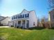 Two-story home with white siding, black shutters, and a well-manicured lawn at 7150 Pheasant Ridge Dr, Indianapolis, IN 46237