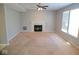 Spacious living room with neutral carpet and a fireplace, offering comfort and style at 7150 Pheasant Ridge Dr, Indianapolis, IN 46237