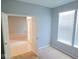 Inviting room with large windows and an open doorway, showcasing the home's layout at 7150 Pheasant Ridge Dr, Indianapolis, IN 46237