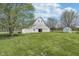 Exterior of barn surrounded by a large yard and mature trees at 7371 E 100 N, Whitestown, IN 46075
