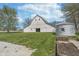 Barn exterior with large yard, storage building and raised garden bed at 7371 E 100 N, Whitestown, IN 46075
