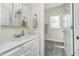 Bathroom with single sink and vanity, and a view into another room at 7371 E 100 N, Whitestown, IN 46075