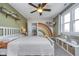 Bright bedroom with a ceiling fan, rainbow wall art, and a comfortable sleeping space at 7371 E 100 N, Whitestown, IN 46075