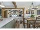 Open-concept kitchen and dining area with wooden accents and lots of natural light at 7371 E 100 N, Whitestown, IN 46075