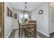 Cozy dining area features a wooden table, four chairs, and stylish decor at 7371 E 100 N, Whitestown, IN 46075