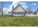 Charming home exterior with a well-manicured lawn, attractive landscaping, and inviting curb appeal at 7371 E 100 N, Whitestown, IN 46075